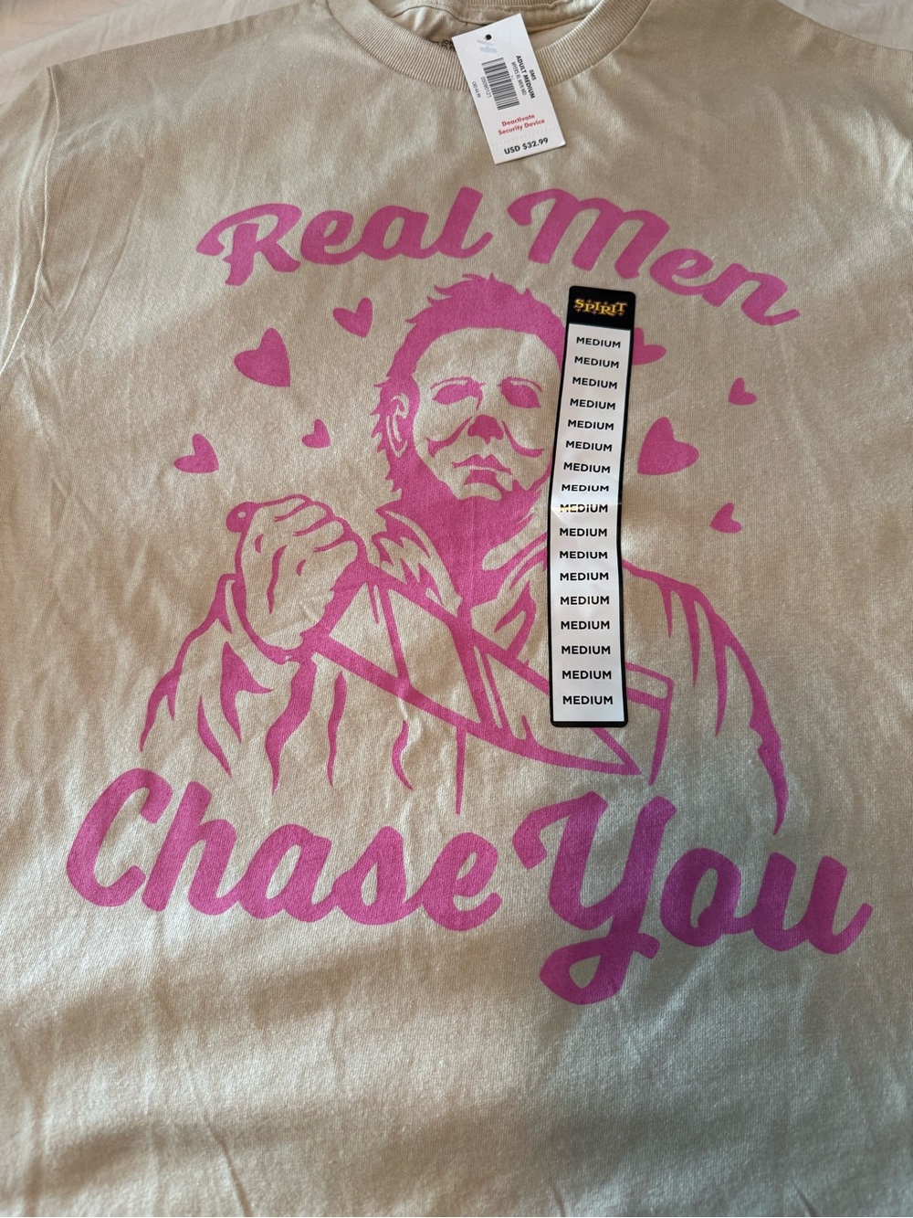 Spirit Cream Tee with Pink 'Real Men Chase You' Graphic